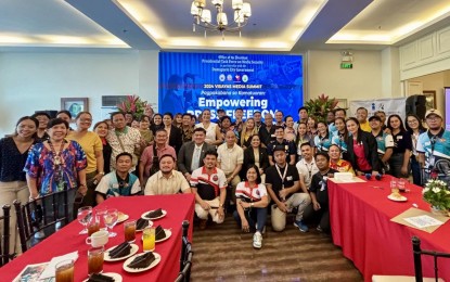 <p><strong>MEDIA SAFETY</strong>. Undersecretary Paul Gutierrez (seated, center), executive director of the Presidential Task Force on Media Safety, is joined by media practitioners from Negros Oriental and neighboring areas, at a summit in Dumaguete City on Friday (July 26, 2024). The task force assured journalists that it is currently working on helping the media get more access to police blotters. (<em>PNA photo by Mary Judaline Flores Partlow)</em></p>