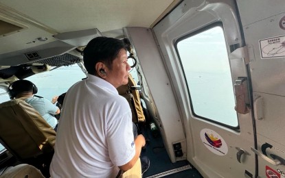 <p><strong>INSPECTION</strong>. President Ferdinand R. Marcos Jr. conducts an aerial inspection in Bataan, Pampanga and Bulacan on Saturday (July 27, 2024) to determine the extent of the damage caused by Typhoon Carina and the oil spill from the sunken M/T Terra Nova in Limay, Bataan. Marcos created an inter-agency task force to quickly address the possible effects of the oil spill. <em>(Photo courtesy of PCO)</em></p>