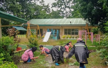 <p><strong>OPENING PREPARATIONS.</strong> Village officials and teaching staff of La Union National High School Sacyud Annex in San Fernando City, La Union continue with the "Brigada Eskwela" preparations amid the weather disturbance on Wednesday (July 24, 2024). Public elementary and high schools will open on Monday (July 29). <em>(Photo courtesy of San Fernando City LGU)</em></p>