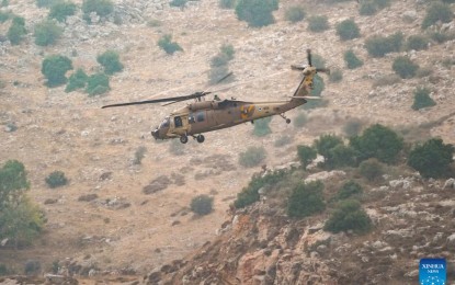 <p><strong>RESCUE.</strong> An Israeli helicopter is seen at the scene of a rocket attack in the Druze town Majdal Shams in the Israeli-occupied Golan Heights on Saturday (July 27, 2024). Israeli medics reported there were at least 30 casualties following the rocket attack. <em>(Xinhua)</em></p>