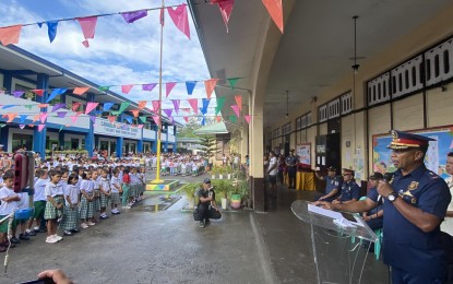 <p><strong>FIRST DAY</strong>. Police Regional Office-Bicol (PRO-5) Regional Director Brig. Gen. Andre Dizon gives his message to learners, teachers, and parents during the opening ceremony of School Year 2024-2025 at Cabangan Elementary School in Barangay Cabangan, Legazpi City on Monday (July 29, 2024). PRO-5 put up 428 assistance desks to ensure police presence within school premises on the opening of classes. <em>(PNA photo by Connie Calipay)</em></p>