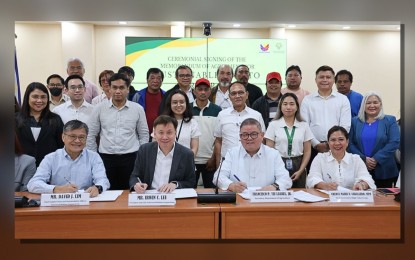 <p><strong>BOOSTING POTATO PRODUCTION.</strong> The Department of Agriculture (DA) and Universal Robina Corporation (URC) sign a five-year agreement to implement the Sustainable Potato Program at the DA main office along Elliptical Road in Quezon City on Monday (July 29, 2024). Signing the memorandum of agreement were URC chief of supply chain and sustainability officer David Lim (from left); URC president and chief executive officer Irwin Lee; DA Secretary Francisco Tiu Laurel Jr. and DA Undersecretary for High Value Crops Cheryl Marie Natividad-Caballero. <em>(Photo courtesy of DA)</em></p>