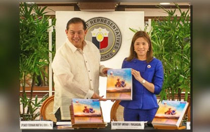 <p><strong>2025 BUDGET.</strong> Speaker Ferdinand Martin G. Romualdez (right) formally accepts the proposed PHP6.352- trillion national budget for 2025 from Budget Secretary Amenah Pangandaman during a simple ceremony held at Romualdez Hall in the House of Representatives on Monday (July 29, 2024). Romualdez said job creation, quality education, expanded health care and social protection are among the priorities of the House in allocating funds.<em> (Photo courtesy of DBM)</em></p>