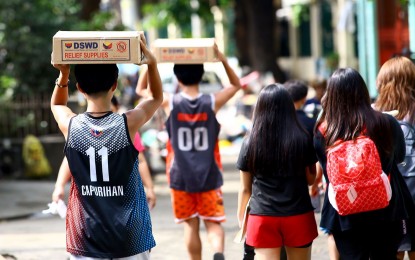 <p><strong>GOV'T CARES.</strong> The Department of Social Welfare and Development distributes family food packs to a community in Quezon City in July 2024. Secretary Rex Gatchalian on Tuesday (Oct. 15) said the administration of President Ferdinand R. Marcos Jr. is committed to helping the Filipino people, with a strong focus on education and developing the economy further. <em>(PNA photo by Joan Bondoc)</em></p>
<p> </p>