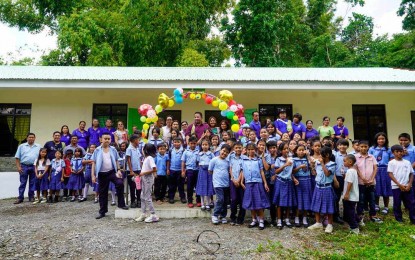 <p><strong>TURNOVER.</strong> Sibalom Municipal Mayor Gian Carlo Occeña, together with teachers and learners, take a pose right after the turnover ceremony of the two-classroom school building at the Fornier Elementary School in Sibalom, Antique on Monday (July 29, 2024). Department of Education (DepEd) Sibalom South District Supervisor Dr. Demar Cahilig said another two-classroom school building was turned over to the Alangan Bongsod Cubay Elementary School at the start of the school year. <em>(Photo courtesy of Sibalom Municipal Mayor Gian Carlo Occeña)</em></p>