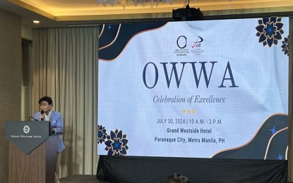 <p><strong>SERVICE TO OFWs.</strong> OWWA chief Arnell Ignacio speaks during the rites for the agency's acceptance of its ISO 9001:2015 recertification from Certification International Philippines Inc. at the Grand Westside Hotel in Parañaque City on Tuesday (July 30, 2024). He said an assessment is underway to determine if there are families of overseas Filipino workers who have been affected by the recent massive floods that hit Metro Manila and nearby areas. <em>(PNA photo by Ferdinand Patinio)</em></p>