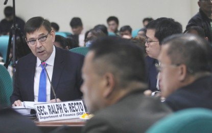 <p><strong>SETTING THE RECORD STRAIGHT.</strong> Finance Secretary Ralph Recto attends the public inquiry conducted by the Senate Committee on Health and Demography on Tuesday (July 30, 2024). Recto assured senators that that the government's move to divert unutilized funds from government-owned-and-controlled corporations to fund projects does not cover contributions to the Philippine Health Insurance Corporation. <em>(PNA photo by Avito C. Dalan)</em></p>