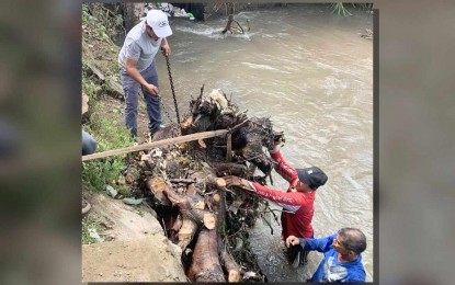 <p><strong>CLEAN-UP WORKS</strong>. National Irrigation Administration (NIA)-Calabarzon personnel and members of irrigators associations conducting desilting and clearing operations along irrigation canals to remove debris and restore water flow after Super Typhoon Carina in this undated photo. NIA placed the estimated damage caused by 'Carina' to its irrigation systems at PHP29.1 million and approximately PHP111.81 million in agricultural losses, especially on rice crops<em>. (Photo courtesy of NIA-Calabarzon)</em></p>