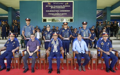 <p><strong>RECOGNITION</strong>. Police awardees (2nd row, standing) pose for a photo opportunity with officials of the Police Regional office in Bicol (PRO5) and some national government agencies during the 29th Police Community Relations Month celebration at Camp Simeon A. Ola on Wednesday (July 31, 2024). PRO5 recognized several of its personnel, units, and partner agencies for their dedication, hard work, and unwavering support to the programs and activities of the Philippine National Police<em>. (Photo courtesy of PRO5)</em></p>