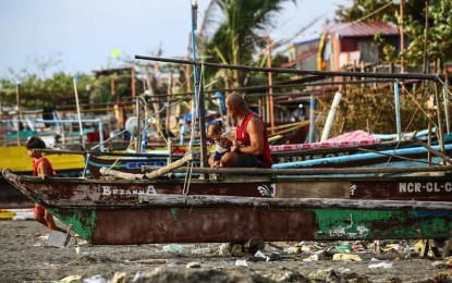 <p><strong>IDLE.</strong> Fishing boats remain idle due to the threat of an oil spill at a coastal village in Rosario, Cavite on July 30, 2024. Bureau of Fisheries and Aquatic Resources (BFAR) Spokesperson Nazario Briguera on Wednesday (August 14, 2024) said that a premature lifting of the fishing ban in Cavite may pose a hazard to public health. <em>(PNA photo by Joan Bondoc)</em></p>