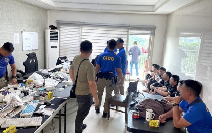 <p><strong>NABBED.</strong> CIDG agents account for pieces of evidence during a search warrant operation in a village at the Clark Freeport Zone in Mabalacat City, Pampanga on Tuesday (July 30, 2024). The CIDG on Wednesday (July 31) said two Chinese suspects were arrested while 13 suspected human trafficking victims were rescued during the operation. <em>(Photo courtesy of CIDG)</em></p>