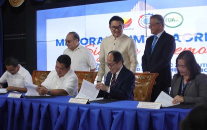 <p><strong>PHARMA ECOZONES</strong>. Philippine Economic Zone Authority (PEZA) Director General Tereso Panga (seated, 2nd from right) and Food and Drug Administration (FDA) Director General Samuel Zacate (seated, 2nd from left) sign a memorandum of agreement at the PEZA headquarters in Pasay City on July 31, 2024. The deal seeks to fast track transactions of pharmaceutical economic zone locators with the FDA. <em>(PNA photo by Avito Dalan)</em></p>