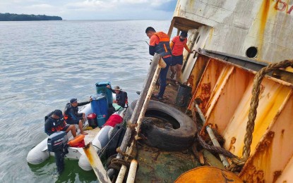 <p><strong>OIL RECOVERY.</strong> Personnel of the Philippine Coast Guard begin on Thursday (Aug. 1, 2024) the manual recovery of oil from MV Mirola 1 that ran aground off the coast of Mariveles, Bataan. The ship is the third vessel containing a cargo of oil that either sank or ran aground in Bataan waters in the last weeks of July. <em>(Photo courtesy of PCG)</em></p>