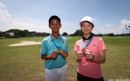 <p><strong>BACK-TO-BACK CHAMPIONS</strong>. AJ Wakan (left) and Johanna Uyking rule their respective divisions in the 13-15 category of the ICTSI Junior PGT Mindanao Series 2 at the South Pacific Golf and Leisure Estates in Davao City on Thursday (Aug. 1, 2024). They also topped the Apo leg last week. <em>(Contributed photo)</em></p>