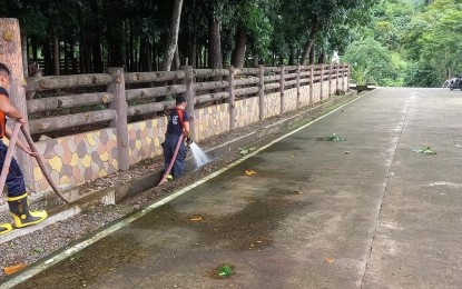 <p><strong>DENGUE ALERT</strong>. A team from the Bureau of Fire Protection in Dumlaneg, Ilocos Norte clears clogged canals and waterways on July 30, 2024, days after Super Typhoon Carina hit. Health executives are continuously urging for public vigilance vs. dengue. <em>(Photo courtesy of BFP Dumalneg)</em></p>