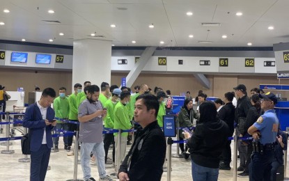 <p><strong>GO HOME</strong>. Twenty-seven Chinese nationals who worked as illegal online gaming workers are deported on Aug. 1, 2024. They were among those found in Philippine Offshore Gaming Operators hubs raided by the Presidential Anti-Organized Crime Commission in Las Piñas and Pasay cities in Metro Manila and in Tarlac province. <em>(Photo courtesy of Bureau of Immigration)</em></p>