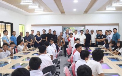 <p><strong>NEW COMPUTER LAB</strong>. Angeles Mayor Carmelo Lazatin Jr. (center) officially opens a state-of-the art computer laboratory at a public school in the city on Tuesday (Aug. 6, 2024). Four computer facilities will open in the locality to boost the students' learning<em>. (Contributed photo)</em></p>