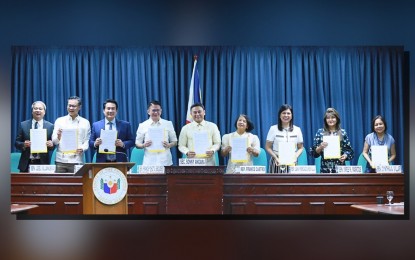 <p><strong>TEACHING ALLOWANCE.</strong> Education Secretary Sonny Angara (center) and lawmakers show the signed copy of the implementing rules and regulations of Republic Act No. 11997, or the "Kabalikat sa Pagtuturo" Act, at the Senate on Wednesday (Aug. 7, 2024). Under the law, teachers will receive PHP5,000 for the school year 2024-2025 and PHP10,000 thereafter to cover expenses for teaching supplies, incidental costs, and various learning delivery methods. <em>(Photo courtesy of Senator Revilla’s office)</em></p>