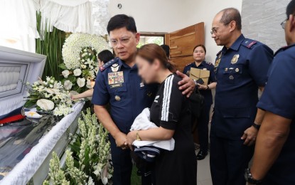 <p><strong>GREAT SACRIFICE.</strong> Philippine National Police (PNP) chief Gen. Rommel Francisco Marbil condoles with the family of the late S/Sgt. Nelson Santiago during the officer's wake on Tuesday (Aug. 6, 2024). Santiago was killed in an anti-kidnapping rescue operation in Pampanga while his colleague, Chief M/Sgt. Eden Accad, was wounded. <em>(Photo courtesy of PNP)</em></p>