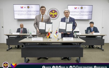 <p><strong>FINANCING AGREEMENTS</strong>. Finance Secretary Ralph Recto (left) and Export-Import Bank of Korea Chairman and President Yoon Hee-sung sign financing agreements on Wednesday (Aug. 7, 2024) at the DOF Office in Manila. The deals were for the Dumaguete Airport Development project and the Economic Development Promotion Facility. <em>(Photo from DOF)</em></p>