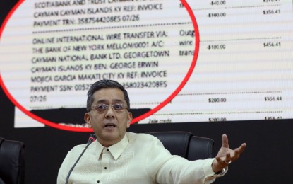 <p><strong>OFFSHORE ACCOUNTS. </strong>Commission on Elections (Comelec) chairperson George Erwin Garcia presents to media documents purportedly showing the origins of his alleged offshore bank accounts in the Cayman Islands during a press briefing at the Comelec main office in Intramuros, Manila, on Thursday (July 17, 2024). Garcia said poll service provider Smartmatic could be behind the alleged demolition job against Comelec, an allegation that Smartmatic said is baseless and mere speculation. <em>(PNA photo by Yancy Lim)</em></p>