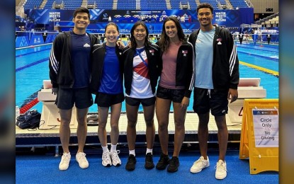 <p><strong>PH SWIMMERS. </strong>Philippine team members (from left) Jerard Dominic Jacinto, Xandi Chua, Thanya Angelyn Dela Cruz, Jasmine Alkhaldi, and Jarod Hatch pose at the competition venue of the 20th World Aquatics Championships in Fukuoka, Japan on July 22, 2023. Jacinto, Chua and Hatch will join the national tryouts this month at Rizal Memorial Sports Complex in Malate, Manila. <em>(Contributed photo by Ryan Paolo Arabejo) </em></p>