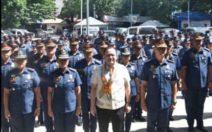 <p><strong>NEW BUILDING.</strong> Cebu City Acting Mayor Raymond Alvin Garcia (center) and Cebu City Police Office (CCPO) Director Antonietto Cañete (4th from left) pose with the command staff and personnel of the Philippine National Police (PNP) in Cebu City on Thursday (Aug. 8, 2024). Garcia bares on Friday (Aug. 9, 2024) that PHP50 million is allocated to construct the new CCPO building.<em> (Photo courtesy of CCPO)</em></p>
<p> </p>