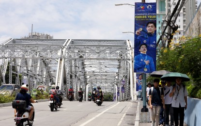 <p><strong>MANILA'S PRIDE.</strong> Tarpaulins welcoming double Paris Olympics gold medalist Carlos Yulo are up in the streets of Manila on Monday (Aug. 12, 2024). Yulo and other members of Team Philippines will meet President Ferdinand R. Marcos Jr. at Malacañan Palace on Tuesday (Aug. 13) while a homecoming parade will take them around Manila on Wednesday (Aug. 14). <em>(PNA photo by Yancy Lim)</em></p>