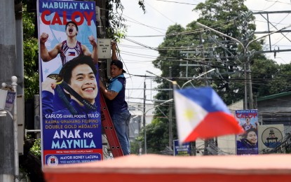 <p><strong>GOLDEN.</strong> The City of Manila puts up welcome streamers for Paris Olympics double gymnastics gold medalist Carlos Yulo in San Miguel District on Monday (Aug. 12, 2024). Yulo and other members of Team Philippines will arrive home Tuesday (Aug. 13). <em>(PNA photo by Yancy Lim) <br /></em></p>