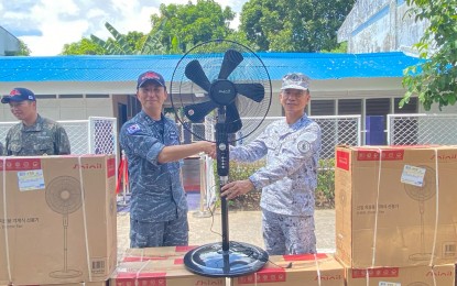 <p><strong>PARTNERSHIP</strong>. Korean Navy Commander Park Jeong-Won (left) shakes hands with Capt. Edwin Nera, Naval Forces Southern Luzon acting commander, during the turnover of the newly renovated Naval Forces Southern Luzon (NFSL) Child Development Center facility in Legazpi City on Monday (Aug. 12, 2024). Aside from the PHP200,000 newly renovated facility, the Korean Navy also donated electric fans and coloring materials for children.<em> (PNA photo by Connie Calipay)</em></p>