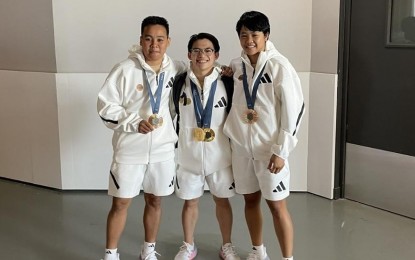 <p>Bronze medalist Nesthy Petecio, double gold medalist Carlos Yulo (center), bronze medalist Aira Villegas. <em>(POC photo)</em></p>