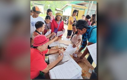 <p><strong>GOVERNMENT AID.</strong> Members of the B’laan indigenous community in Tulunan, North Cotabato, become recipients of the Philippine Crop Insurance Corporation coverage on Monday (Aug. 12, 2024) for the safety of their agricultural produce. The initiative is a project of the Department of Agrarian Reform (DAR) in North Cotabato, with the help of the DAR central office, to assist the IPs in preventing the risks of disasters by insuring their coconut farms. <em>(Photo courtesy of DAR North Cotabato)</em></p>