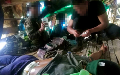 <p><strong>EXTENDING HELP.</strong> Troops of the 1st Special Forces Battalion administer first aid to Arnel Arcayan, a political guide of the Platun Uno of the New People’s Army, who is wounded in an encounter at Barangay Tignapoloan, Cagayan de Oro City, on Aug. 5, 2024. On Tuesday (Aug. 13), Maj. Gen. Jose Maria Cuerpo ll, the Army's 4th Infantry Division commander, bares that Northern Mindanao is free from communist guerilla fronts. <em>(Photo courtesy of 4ID)</em></p>