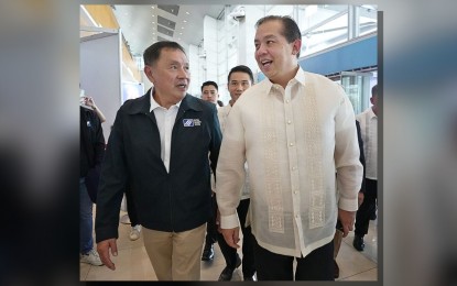 <p><strong>SSS COVERAGE</strong>. Social Security System (SSS) president Rolando Macasaet (left) and Speaker Martin Romualdez engage in a cordial conversation on the sidelines of the Liga ng mga Barangay sa Pilipinas 2024 National Congress at the World Trade Center in Pasay City on Tuesday (Aug. 13, 2024). During his speech, Romualdez pushed for social security protection for village officials to provide them with life insurance coverage and enable them to qualify for a lifetime pension upon retirement. <em>(Photo courtesy of the House Press and Public Affairs Bureau)</em></p>