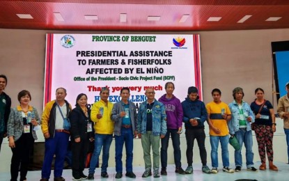 <p><strong>AID DISTRIBUTION</strong>. Some of the 775 farmers and fisherfolk in Kibungan town in Benguet province pose after receiving their PHP10,000 cash assistance from the Office of the President, at the municipal covered court on Tuesday (Aug. 13, 2024). About PHP29.74 million was allocated for Benguet's agriculture stakeholders. <em>(Photo courtesy of Benguet Governor’s office)</em></p>