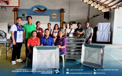 <p><strong>SOLAR DRYERS</strong>. Members of a farmers’ group in San Jacinto town, Pangasinan during the turnover of Portasol solar drying trays by the Department of Science and Technology on Aug 6, 2024 at the town’s covered court. Some 15 solar drying trays were distributed to four farmer groups in San Jacinto. <em>(Photo courtesy of DOST Ilocos Region)</em></p>