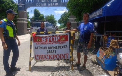 <div dir="auto"> </div>
<div dir="auto"><strong>CHECKPOINT</strong>. A police personnel and a village official man the checkpoint at Barangay Pantar Norte in Balaoan town, La Union province in accordance with the ongoing ban on the entry and exit of pigs and pork products in the town due the African swine fever (ASF) in this undated photo. Authorities said 17 out of the municipality’s 36 villages have recorded positive ASF cases. <em>(Photo courtesy of Balaoan Police Station) </em></div>