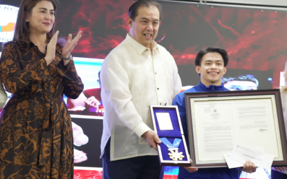 <p><strong>MEDAL OF EXCELLENCE</strong>. Speaker Martin Romualdez and his wife Tingog Party-list Rep. Yedda Marie Romualdez hand over to 2024 Olympic double gold medalist Carlos Yulo the Congressional Medal of Excellence, a copy of House Resolution No. 241, congratulating members of the Philippine delegation for their historic feat in the 2024 Paris Olympics, as well as cash incentives from the chamber in a simple ceremony at the Romualdez Hall on Wednesday (Aug. 14, 2024). The congressional reception hosted by the House of Representatives gave honor and recognition to the Filipino athletes who participated in the 2024 Paris Olympics. <em>(Photo courtesy of House Press and Public Affairs Bureau)</em></p>