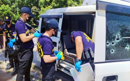 <p><strong>AMBUSH.</strong> Police conducts a post-crime investigation on a car where the MILF commander and his driver were injured after they were ambushed on Tuesday (Aug. 13, 2024) in Barangay Dalican, Datu Odin Sinsuat, Maguindanao del Norte. Police authorities are looking at 'rido' or family feud with another Moro clan as a possible motive that triggered the gun attack.<em> (Courtesy of Datu Odin Sinsuat MPS)</em></p>
<p><em> </em></p>