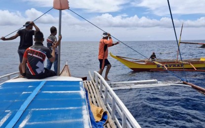 <p><strong>SEARCHING.</strong> Philippine Coast Guard personnel are coordinating with local fisherfolk on the search for a missing fisherman in Masbate waters on Thursday (Aug. 15, 2024). The PCG said the fisher went missing after their boat collided with another vessel off Burias Island in Masbate on Saturday (Aug. 10). <em>(Photo courtesy of PCG)</em></p>