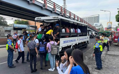 <p><strong>FREE TRANSPORT.</strong> An emergency rescue vehicle transports mostly workers and students stranded due to the transport strike in Bacolod City on Thursday (Aug. 15, 2024). City government vehicles transport passengers who could not be accommodated by modern and consolidated traditional jeepneys. <em>(Photo courtesy of Bacolod City PIO)</em></p>