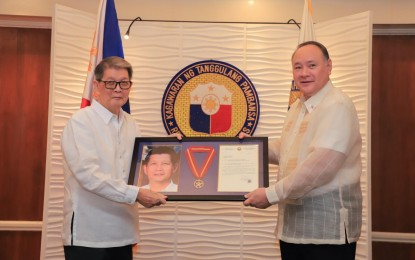 <p><strong>LEGACY HONORED.</strong> Former defense secretary Renato de Villa (left) receives the Outstanding Achievement Medal from incumbent Department of National Defense (DND) chief Gilberto Teodoro Jr. at the agency's headquarters on Thursday (Aug. 15, 2024). De Villa served as the country's 18th DND chief from July 20, 1991 to Sept. 15 1997. <em>(Photo courtesy of the DND)</em></p>