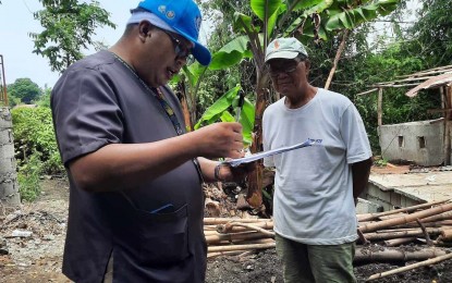 <p><strong>PINK ZONE.</strong> Antique Provincial Veterinary chief of Public Health Division Dr. Marco Rafael Ardamil (left) interviews a hog raiser in San Jose de Buenavista on June 4, 2024. Ardamil said Friday (Aug. 16) that two municipalities in the province have been reclassified into pink zone after the absence of African swine fever cases for over a year now. (<em>Photo courtesy of Antique ProVet)</em></p>