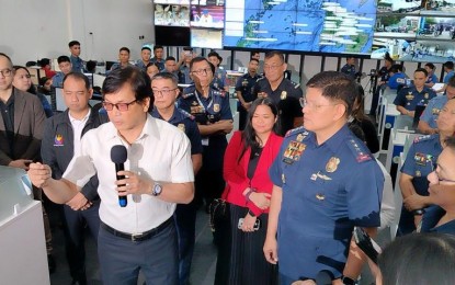 <p><strong>QUICK RESPONSE.</strong> DILG Secretary Benjamin Abalos Jr. (left) and PNP chief Gen. Rommel Francisco Marbil (right) lead the simulation of the police force's new 911 emergency service in Camp Crame, Quezon City on Friday (Aug. 16, 2024). The PNP said it aims for a three-minute response time to emergencies through the new system. <em>(PNA photo by Lloyd Caliwan)</em></p>