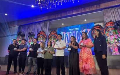 <p><strong>SAPPHIRE MASSKARA.</strong> Bacolod City Mayor Alfredo Abelardo Benitez (6th from left) and Bacolod Yuhum Foundation Inc. president Katherine Matiling (extreme right), with other city officials, lead the launch of the 45th MassKara Festival at L'Fisher Hotel on Saturday (Aug. 17, 2024). This year's festivity, dubbed the Sapphire Edition, is set Oct. 11 to 27. <em>(Photo courtesy of Bacolod City-PIO)</em></p>