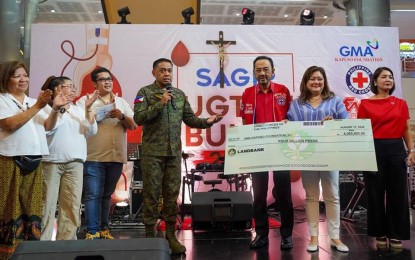 <p><strong>AFP CARES.</strong> Armed Forces of the Philippines (AFP) chief Gen. Romeo S. Brawner turns over the PHP4-million check to the GMA Kapuso Foundation Inc. to help the victims of Typhoon Carina on Saturday (Aug. 17, 2024). The amount was donated by the soldiers from their subsistence allowance<em>. (AFP photo from Facebook)</em></p>