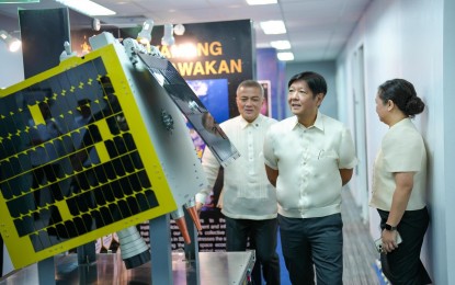 <p><strong>SPACE TECH</strong>. President Ferdinand R. Marcos Jr. tours the Philippine Space Agency (PhilSA) head office in Quezon City before presiding over the 8th Philippine Space Council Meeting on Aug. 12, 2024. The President was presented a replica of the Multispectral Unit for Land Assessment (MULA) satellite, PhilSA's current flagship project that is eyed to be launched by early 2026. <em>(Photo from Bongbong Marcos Facebook)</em></p>