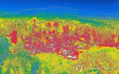 <p>The red portion of the image of downtown Seoul, taken from Mount Nam with an infrared camera on Aug. 19, 2024, shows the scorching heat as the mercury reached 35 C. <em>(Yonhap)</em></p>