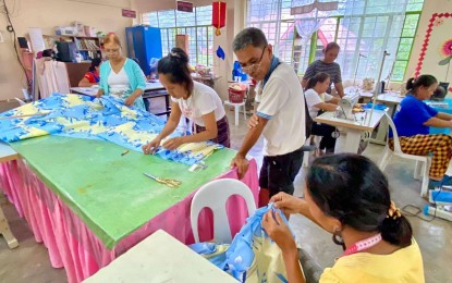 <p><strong>SKILLS TRAINING.</strong> Members of Sustainable Livelihood Program Associations in Masbate province participate in a hands-on training for garment making in this undated photo. The Department of Social Welfare and Development-Bicol said on Tuesday (Aug. 20, 2024) the groups received training and a seed capital of PHP435,000. <em>(Photo courtesy of DSWD-Bicol)</em></p>