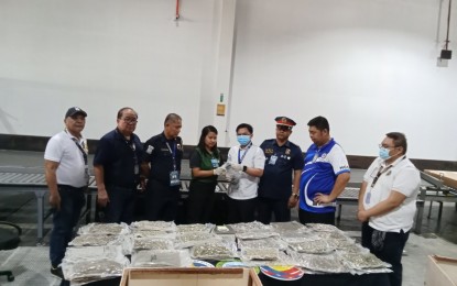 <p><strong>BIG HAUL.</strong> Members of the Clark-Drug Interdiction Task Group (DITG) account for PHP16.1 million worth of kush seized at the Clark Freeport Zone on Monday (Aug. 19, 2024). The contraband was concealed in two wooden crates declared as sofa sets. <em>(Photo courtesy of PNP AVSEGROUP) </em></p>